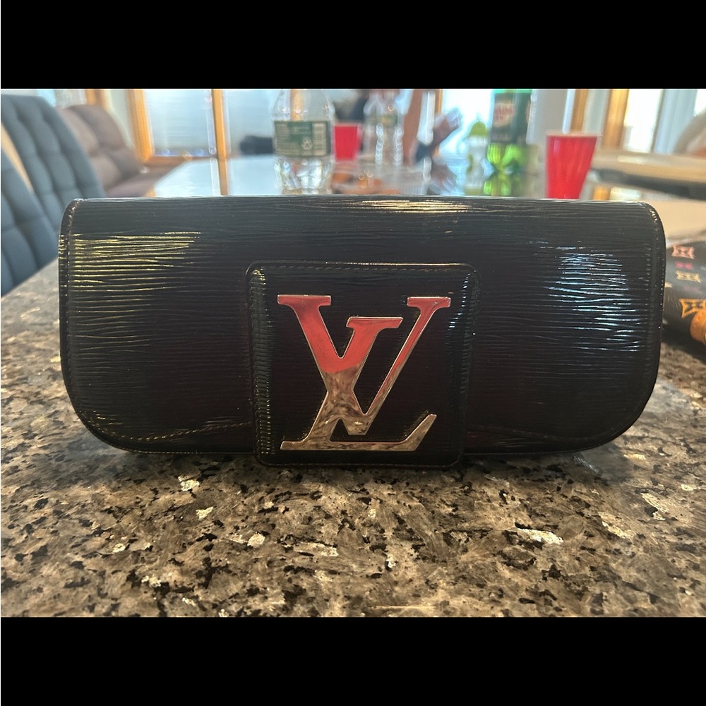 Louis Vuitton Shiny Black Clutch with Silver Logo